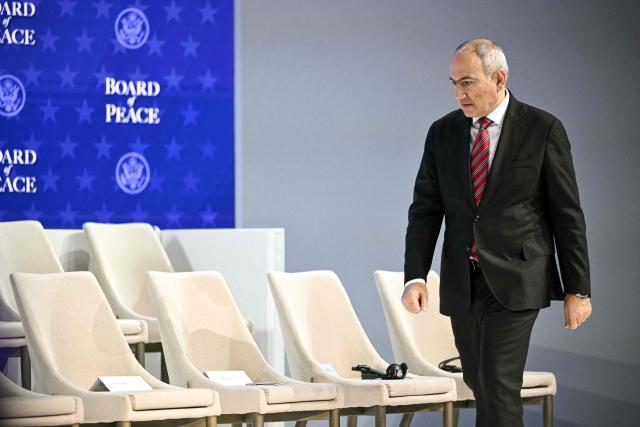 Armenia's Prime Minister Nikol Pashinyan arrives to attend the "Board of Peace" meeting during the World Economic Forum (WEF) annual meeting in Davos on January 22, 2026. US President Donald Trump will show off his new "Board of Peace" at Davos on January 22, 2026 burnishing his claim to be a peacemaker a day after backing off his own threats against Greenland. Originally meant to oversee the rebuilding of Gaza after the war between Hamas and Israel, the board's charter does not limit its role to the Strip, and has sparked concerns that Trump wants it to rival the United Nations. (Photo by Mandel NGAN / AFP)