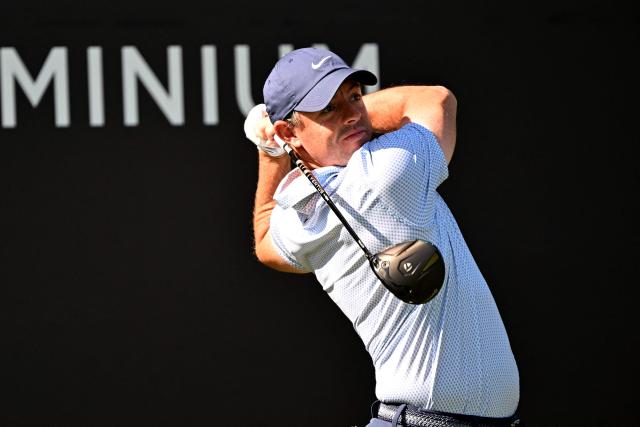 Rory McIlroy of Northern Ireland plays a shot on the 5th hole during the first day of the Hero Dubai Desert Classic golf tournament at the Emirates Golf Club in Dubai on January 22, 2026. (Photo by Giuseppe CACACE / AFP)