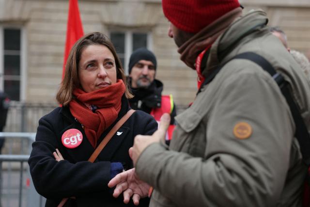 French trade union General Confederation of Labour (CGT) secretary general Sophie Binet takes part in a demonstration to protest against a proposed law to remove International Workers' Day from the list of public holidays, outside the Palais Bourbon in Paris, on January 22, 2026. (Photo by Thomas SAMSON / AFP)