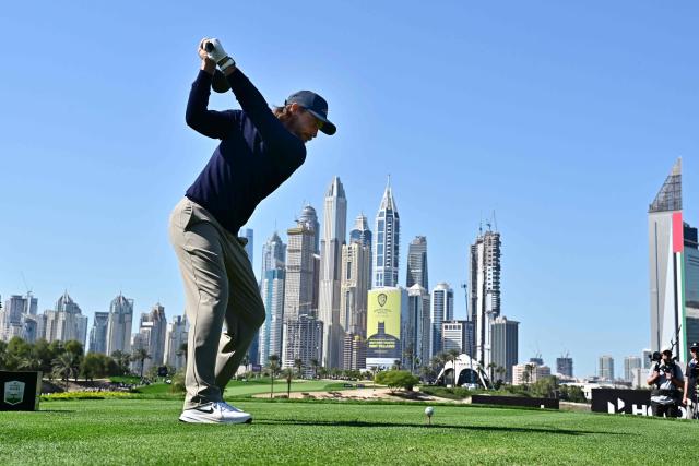 Tommy Fleetwood of England plays a shot on the 8th hole during the first day of the Hero Dubai Desert Classic golf tournament at the Emirates Golf Club in Dubai on January 22, 2026. (Photo by Giuseppe CACACE / AFP)