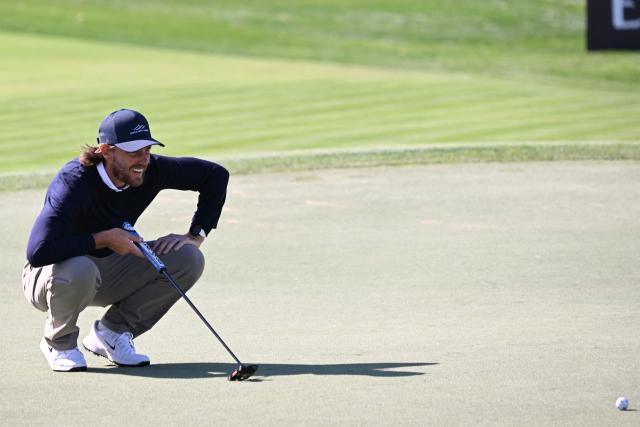 Tommy Fleetwood of England watches after playing a shot on the 3th hole during the first day of the Hero Dubai Desert Classic golf tournament at the Emirates Golf Club in Dubai on January 22, 2026. (Photo by Giuseppe CACACE / AFP)