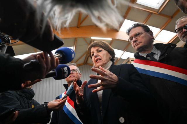 French Minister of Agriculture, Food and Food Sovereignty, Annie Genevard addresses the media in Creances, northern France, during a visit concerning aid measures and the emergency agricultural law, on January 22, 2026. (Photo by Lou BENOIST / AFP)