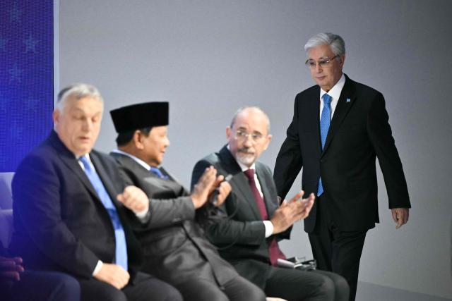 Kazakh President Kassym-Jomart Tokayev arrives at the "Board of Peace" meeting during the World Economic Forum (WEF) annual meeting in Davos on January 22, 2026. US President Donald Trump will show off his new "Board of Peace" at Davos on January 22, 2026 burnishing his claim to be a peacemaker a day after backing off his own threats against Greenland. Originally meant to oversee the rebuilding of Gaza after the war between Hamas and Israel, the board's charter does not limit its role to the Strip, and has sparked concerns that Trump wants it to rival the United Nations. (Photo by Mandel NGAN / AFP)