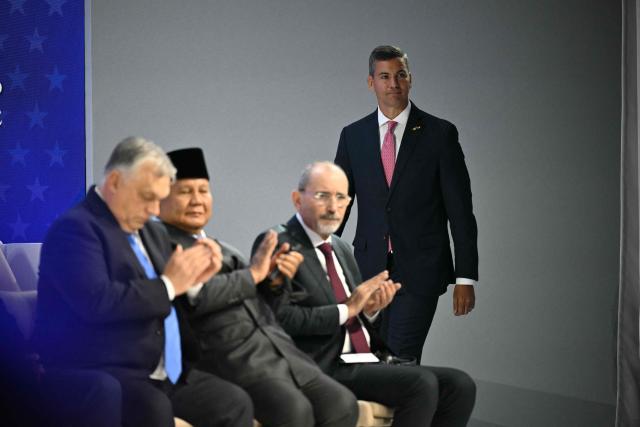 Paraguay's President Santiago Pena arrives at the "Board of Peace" meeting during the World Economic Forum (WEF) annual meeting in Davos on January 22, 2026. US President Donald Trump will show off his new "Board of Peace" at Davos on January 22, 2026 burnishing his claim to be a peacemaker a day after backing off his own threats against Greenland. Originally meant to oversee the rebuilding of Gaza after the war between Hamas and Israel, the board's charter does not limit its role to the Strip, and has sparked concerns that Trump wants it to rival the United Nations. (Photo by Mandel NGAN / AFP)