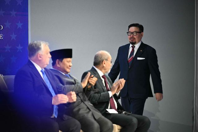 Mongolia's Prime minister Gombojav Zandanshatar arrives at the "Board of Peace" meeting during the World Economic Forum (WEF) annual meeting in Davos on January 22, 2026. US President Donald Trump will show off his new "Board of Peace" at Davos on January 22, 2026 burnishing his claim to be a peacemaker a day after backing off his own threats against Greenland. Originally meant to oversee the rebuilding of Gaza after the war between Hamas and Israel, the board's charter does not limit its role to the Strip, and has sparked concerns that Trump wants it to rival the United Nations. (Photo by Mandel NGAN / AFP)