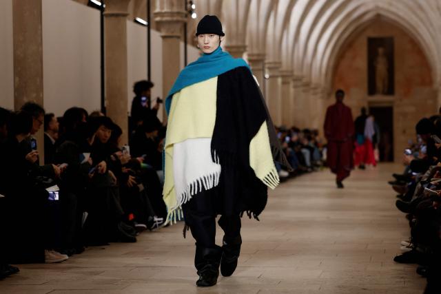 A model presents a creation by Issey Miyake for the Menswear Ready-to-wear Fall-Winter 2026/2027 collection as part of the Men Paris Fashion Week in Paris on January 22, 2026.  (Photo by Ian LANGSDON / AFP)