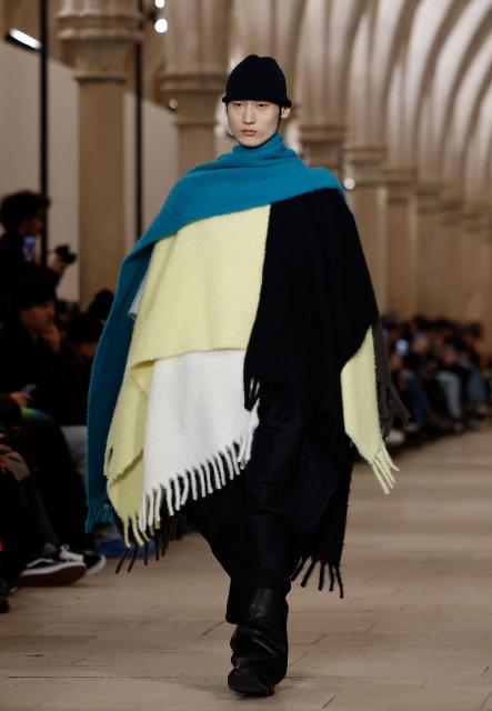 A model presents a creation by Issey Miyake for the Menswear Ready-to-wear Fall-Winter 2026/2027 collection as part of the Men Paris Fashion Week in Paris on January 22, 2026.  (Photo by Ian LANGSDON / AFP)