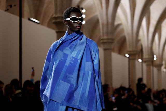 TOPSHOT - A model presents a creation by Issey Miyake for the Menswear Ready-to-wear Fall-Winter 2026/2027 collection as part of the Men Paris Fashion Week in Paris on January 22, 2026.  (Photo by Ian LANGSDON / AFP)