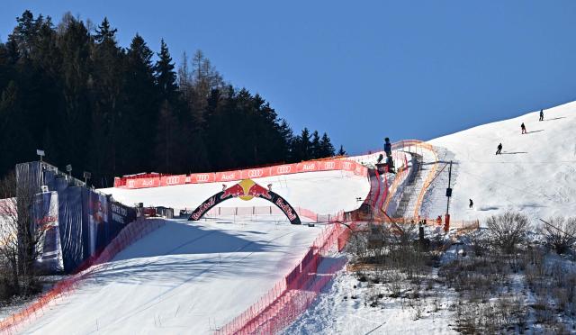 Recreational skiers ski outside of the "Red Bull jump" at the famous "Streif" (Hahnenkamm downhill course) at the ski resort of Kitzbuehel, Austria on a free day of the Men's FIS Alpine Skiing World Cup Austria on January 22, 2026. (Photo by Joe Klamar / AFP)