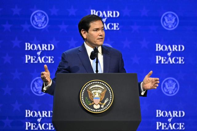 US Secretary of State Marco Rubio gestures as he speaks at the "Board of Peace" meeting during the World Economic Forum (WEF) annual meeting in Davos on January 22, 2026. US President Donald Trump will show off his new "Board of Peace" at Davos on January 22, 2026 burnishing his claim to be a peacemaker a day after backing off his own threats against Greenland. Originally meant to oversee the rebuilding of Gaza after the war between Hamas and Israel, the board's charter does not limit its role to the Strip, and has sparked concerns that Trump wants it to rival the United Nations. (Photo by Fabrice COFFRINI / AFP)