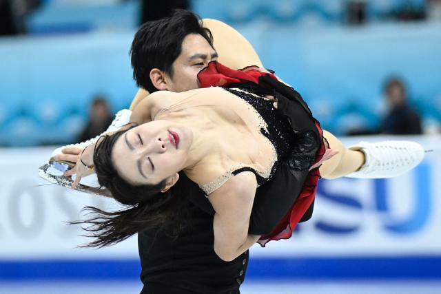 China’s Sui Wenjing and Han Cong perform in the pairs short program during the ISU figure skating Four Continents Championships 2026 in Beijing on January 22,2026. (Photo by WANG Zhao / AFP)