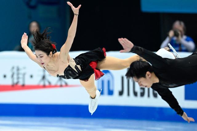 China’s Sui Wenjing and Han Cong perform in the pairs short program during the ISU Figure Skating Four Continents Championships 2026 in Beijing on January 22, 2026. (Photo by WANG Zhao / AFP)