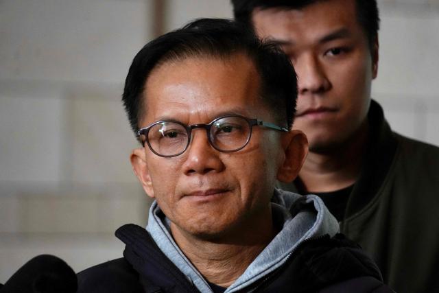 Philip Chiu, a relative of Lamma IV ferry disaster victims, speaks to reporters at Hong Kong's West Kowloon Law Courts Building after the city's coroner delivered the verdict on the accident, which killed 39 in total in 2012, on January 22, 2026. Family members of those killed in a Hong Kong ferry collision were "outraged" by a long-awaited coroner's verdict, saying on January 22, it offered little by way of accountability or closure. (Photo by Tommy WANG / AFP)