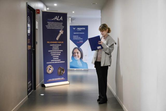 Job seekers and representatives of aerospace companies gather at an 'AeroDay' recruitment event organized by the Randstad Group, at the Stadium de Toulouse in Toulouse on January 22, 2026. According to organizers, some 2,800 positions are to be filled across the French aeronautics, defense and space industry sectors. (Photo by Ed JONES / AFP)