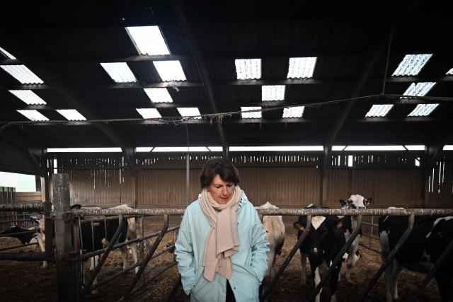 French Minister of Agriculture, Food and Food Sovereignty, Annie Genevard looks on during a visit to a farm to discuss aid measures and the emergency agricultural law, in Saint-Georges-de-la-Riviere, northern France, on January 22, 2026. (Photo by Lou BENOIST / AFP)