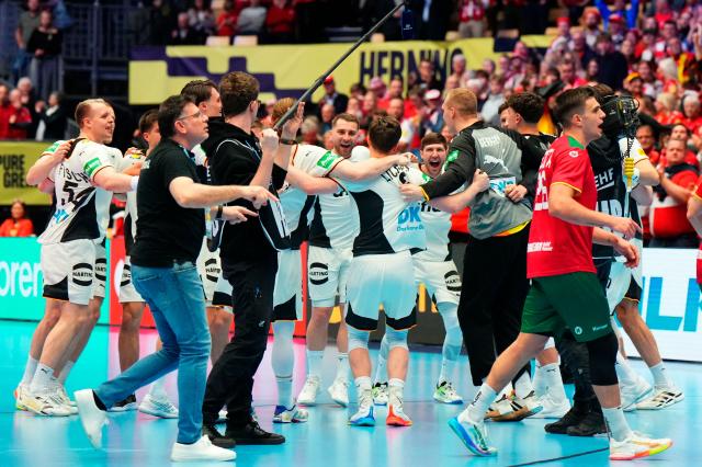 Germany's players celebrate during the men's EHF Euro 2026 main round handball match Germany vs Portugal in Herning, Denmark, on January 22, 2026. (Photo by Sebastian Elias Uth / Ritzau Scanpix / AFP) / Denmark OUT