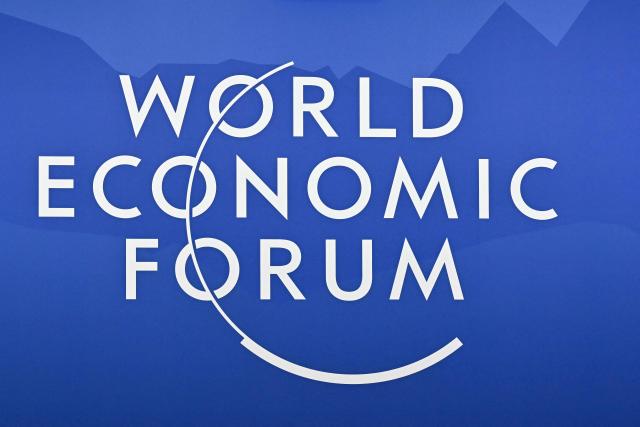 This photograph shows the logo of the World Economic Forum (WEF) in Davos on January 22, 2026. The World Economic Forum takes place in Davos from January 19 to January 23, 2026. (Photo by Fabrice COFFRINI / AFP)