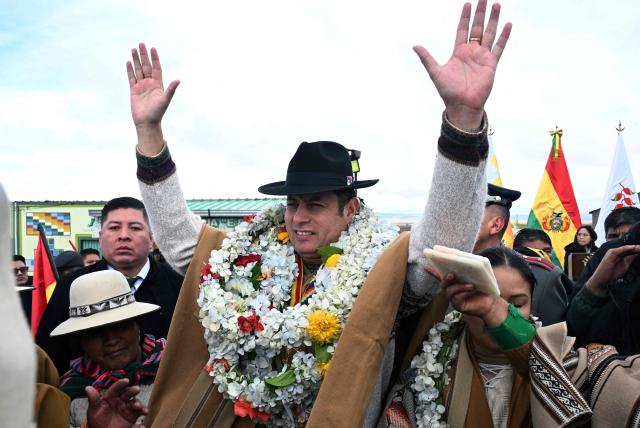 Bolivia's Vice President Edman Lara waves during the celebrations marking the Day of the Plurinational State, a day characterized by ancestral Andean rituals, held in the Apacheta area of the city of El Alto, along the highway connecting La Paz and Oruro, on January 22, 2026. (Photo by Aizar RALDES / AFP)