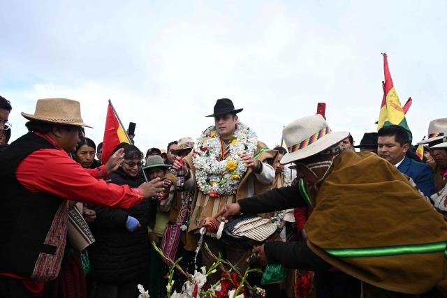 Bolivia's Vice President Edman Lara takes part in an ancestral Andean ritual during the celebrations marking the Day of the Plurinational State, in the Apacheta area of the city of El Alto, along the highway connecting La Paz and Oruro, on January 22, 2026. (Photo by Aizar RALDES / AFP)