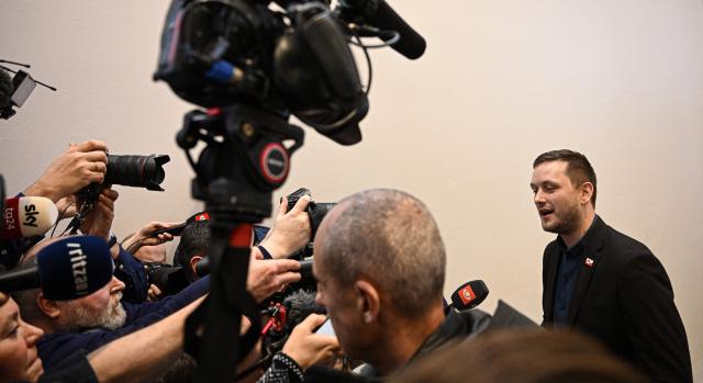 Greenland's Prime Minister Jens-Frederik Nielsen addresses a press conference on January 22, 2026 in Greenland's capital Nuuk. (Photo by Jonathan Nackstrand / AFP)