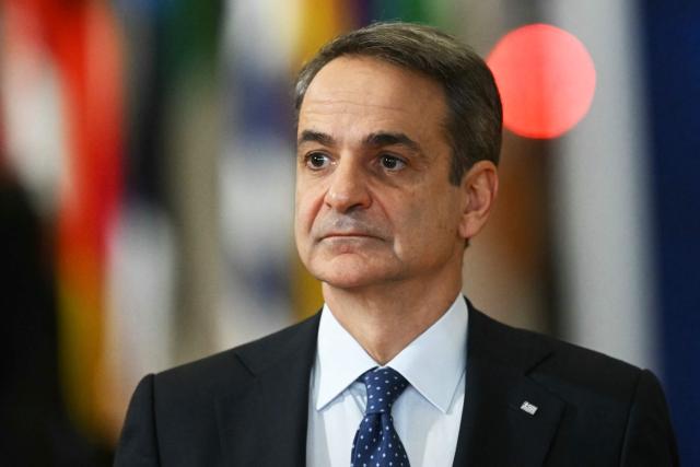 Greece's Prime Minister Kyriakos Mitsotakis arrives for a European Council meeting to discuss recent developments in transatlantic relations, in Brussels, on January 22, 2026. EU leaders meet on January 22, 2026, for an emergency summit on threats by US President to impose tariffs on countries opposed to his push to take Greenland, with crisis talks in Brussels coming to weigh potential countermeasures against the United States. (Photo by NICOLAS TUCAT / AFP)