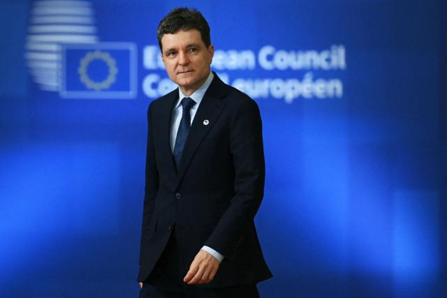 Romania's President Nicusor Dan arrives for a European Council meeting to discuss recent developments in transatlantic relations, in Brussels, on January 22, 2026. EU leaders meet on January 22, 2026, for an emergency summit on threats by US President to impose tariffs on countries opposed to his push to take Greenland, with crisis talks in Brussels coming to weigh potential countermeasures against the United States. (Photo by NICOLAS TUCAT / AFP)