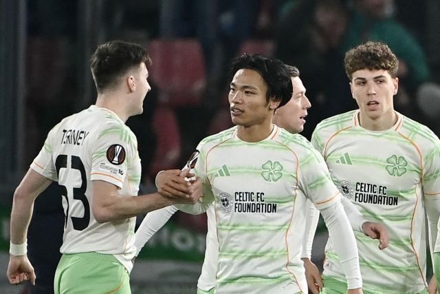 Celtic's Japanese midfielder #41 Reo Hatate (C) celebrates scoring his team's first goal during the Europa League 1st round day 7 football match between Bologna and Celtic at Stadio Renato Dall'Ara in Bologna on January 22, 2026. (Photo by Isabella BONOTTO / AFP)