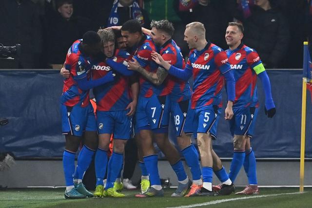 Viktoria Plzen's Czech midfielder #06 Lukas Cerv celebrates with his team mates after scoring his team's first goal during the UEFA Europa League first round - day 7 football match between FC Viktoria Plzen and FC Porto in Plzen, Czech Republic on January 22, 2026. (Photo by Michal Cizek / AFP)