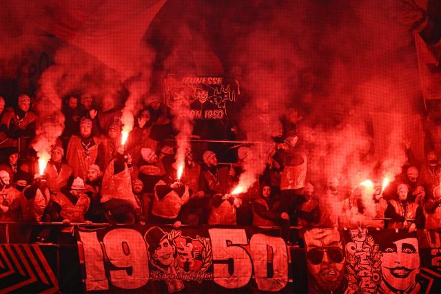 Lyon’s supporters light flares and smoke bombs during the Europa League 1st round day 7 football match between Young Boys and Olympique Lyonnais (OL) at Stadion Wankdorf in Bern on January 22, 2026. (Photo by Sйbastien BOZON / AFP)