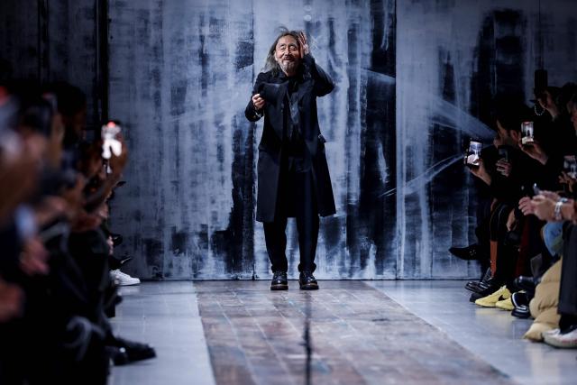 Japanese fashion designer Yohji Yamamoto acknowledges the audience at the end of his Menswear Ready-to-wear Fall-Winter 2026/2027 collection fashion show as part of the Men Paris Fashion Week in Paris on January 22, 2026.  (Photo by Ian LANGSDON / AFP)