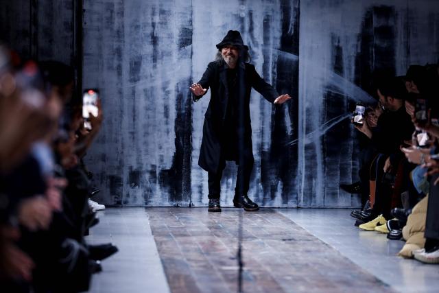 Japanese fashion designer Yohji Yamamoto acknowledges the audience at the end of his Menswear Ready-to-wear Fall-Winter 2026/2027 collection fashion show as part of the Men Paris Fashion Week in Paris on January 22, 2026.  (Photo by Ian LANGSDON / AFP)
