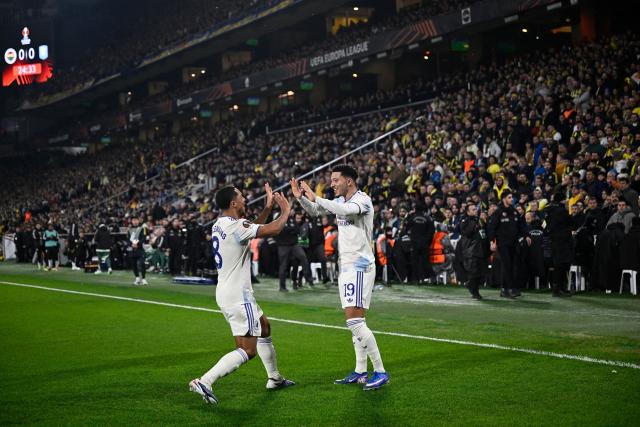 Aston Villa's English forward #19 Jadon Sancho (R) celebrates with Aston Villa's Belgian midfielder #08 Youri Tielemans after scoring his team's first goal during the Europa League 1st round day 7 football match between Fenerbahce and Aston Villa at Sukru Saracoglu Stadium in Istanbul on January 22, 2026. (Photo by Yasin AKGUL / AFP)