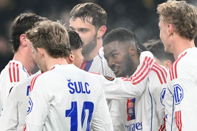 Lyon's English defender #98 Ainsley Maitland-Niles (2R) celebrates with teammates after scoring Lyon's first goal during the UEFA Europa League, league phase, football match between Young Boys and Olympique Lyonnais (OL) at the Wankdorf stadium in Bern on January 22, 2026. (Photo by Sébastien BOZON / AFP)
