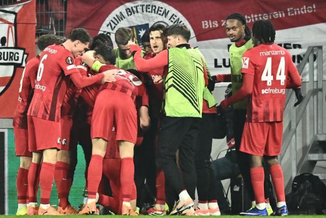 Freiburg's German forward #31 Igor Matanovic celebrates with his team mates after scoring his team's first goal 1:0 during the UEFA Europa League first round - day 7 football match between SC Freiburg and Maccabi Tel Aviv in Freiburg, southwestern Germany, on January 22, 2026. (Photo by Silas STEIN / AFP)