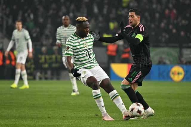 Ferencvaros' Nigerian forward #11 Bamidele Yusuf and Panathinaikos' Greek forward #11 Anastasios Bakasetas vie for the ball during the UEFA Europa League football match 1st round- Day 7 between Ferencvarosi TC and Panathinaikos in Budapest, Hungary on January 22, 2026. (Photo by Attila KISBENEDEK / AFP)