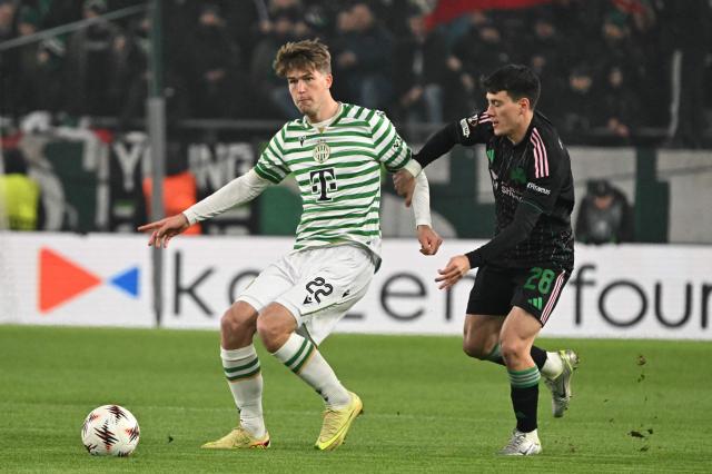 Ferencvaros' Hungarian defender #22 Gabor Szalai and Panathinaikos' Uruguayan midfielder #28 Facundo Pellistri vie for the ball during the UEFA Europa League football match 1st round- Day 7 between Ferencvarosi TC and Panathinaikos in Budapest, Hungary on January 22, 2026. (Photo by Attila KISBENEDEK / AFP)