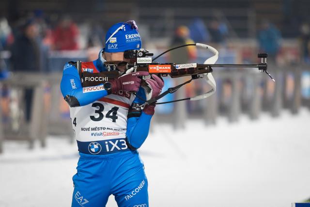 Italy's Lukas Hofer shoots in the men's 15 km short individual event of the IBU Biathlon World Cup in Nove Mesto, Czech Republic, on January 22, 2026. (Photo by Radek Mica / AFP)