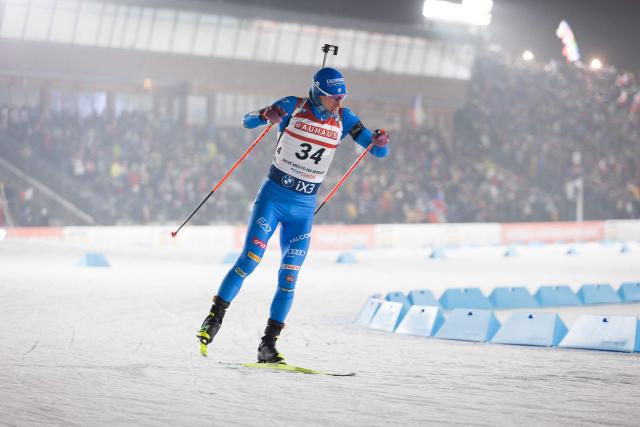Italy's Lukas Hofer competes in the men's 15 km short individual event of the IBU Biathlon World Cup in Nove Mesto, Czech Republic, on January 22, 2026. (Photo by Radek Mica / AFP)