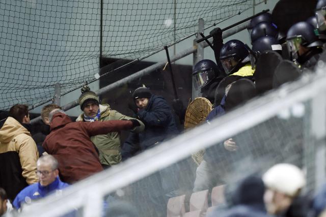Dutch police in riot gear operate in a section with Genk supporters before the UEFA Europa League 1st round day 7 football match between FC Utrecht and KRC Genk at the Galgenwaard Stadium in Utrecht, Netherlands, on January 22, 2026. (Photo by Robin van Lonkhuijsen / ANP / AFP) / Netherlands OUT