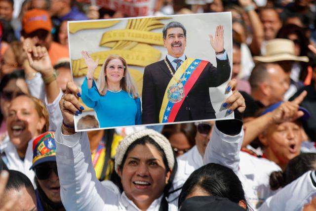 Supporters of ousted Venezuelan President Nicolas Maduro, including health sector workers, take part in a demonstration to the UN headquarters in Caracas to demand his release, on January 22, 2026. (Photo by Pedro MATTEY / AFP)