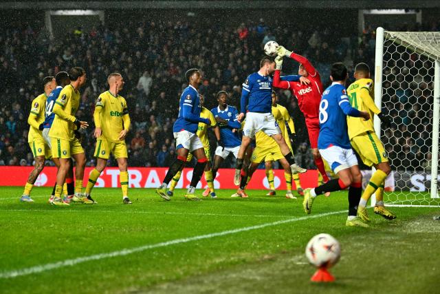 Ludogorets Razgrad's German  #39 Hendrik Bonmann saves a shot from Rangers' Belgian midfielder #43 Nicolas Raskin during the UEFA Europa League, league-stage football match between Rangers and Ludogorets Razgrad at the Ibrox Stadium in Glasgow on January 22, 2026. (Photo by ANDY BUCHANAN / AFP)
