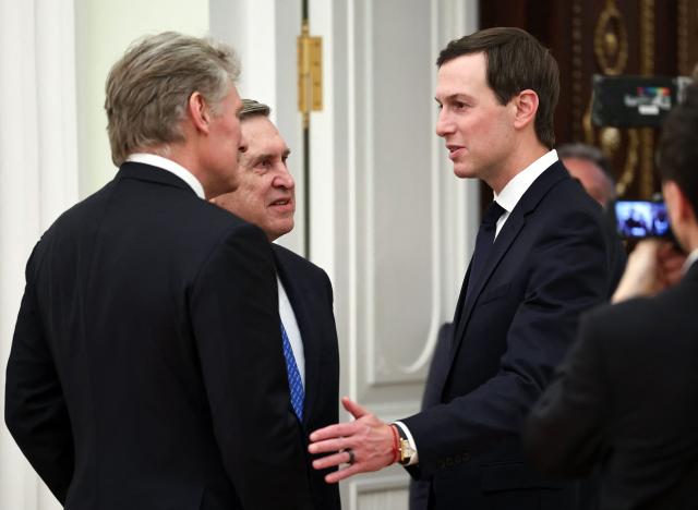 In this pool photograph distributed by the Russian state agency Sputnik, Kremlin spokesman Dmitry Peskov, Kremlin foreign policy aide Yuri Ushakov and US President Donald Trump's son-in-law Jared Kushner talk to each other prior to a meeting with Russia's President at the Kremlin in Moscow on January 22, 2026. (Photo by Alexander KAZAKOV / POOL / AFP)