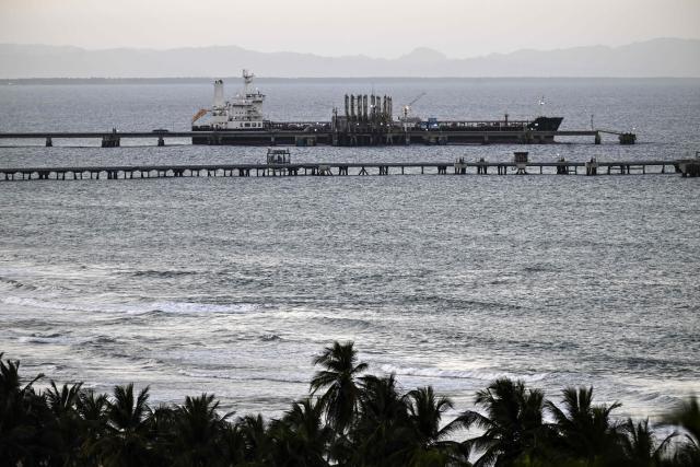 A tanker is docked at the El Palito refinery pier in Puerto Cabello, Carabobo state, Venezuela, on January 22, 2026. (Photo by Ronaldo SCHEMIDT / AFP)