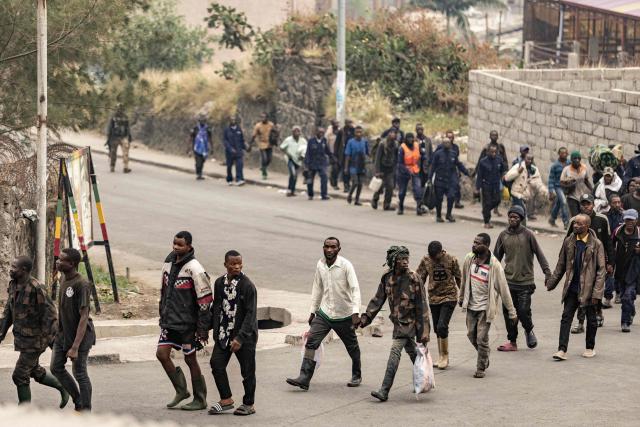 (FILES) Alleged members of the Congolese military, Wazalendo (Patriots in Swahili) militiamen, and other Congolese forces walk in line while being escorted by members of the M23 armed group in Goma on January 28, 2025. A year after the M23 armed group seized Goma, residents of the major city in eastern DRC are living in a "catastrophic" situation, according to the Congolese government spokesperson.
On January 26, 2025, a million residents were sheltering in their homes when the Congolese army and its allies abandoned the capital of North Kivu province. Hundreds of Rwandan soldiers, allied with the anti-government armed group M23, had just crossed the border and entered the lakeside city, at the cost of intense fighting that left thousands dead.
Felix Tshisekedi, his successor as the DRC's president, accuses Kabila of being the brains behind the armed group. (Photo by AFP)