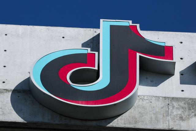 (FILES) The TikTok logo is displayed on signage outside TikTok social media app company offices in Culver City, California on September 30, 2025. TikTok announced on January 22, 2026 that it has established a majority American-owned joint venture to operate its US business that will allow the company to avoid a ban over its Chinese ownership. The TikTok USDS Joint Venture LLC will serve more than 200 million users and 7.5 million businesses while implementing strict safeguards for data protection, algorithm security and content moderation, the company said. (Photo by Patrick T. Fallon / AFP)