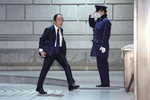 Bank of Japan Governor Kazuo Ueda (L) arrives at the Bank of Japan headquarters to attend the monetary policy meeting
in Tokyo on January 23, 2026. (Photo by JAPAN POOL / JIJI PRESS / AFP) / Japan OUT