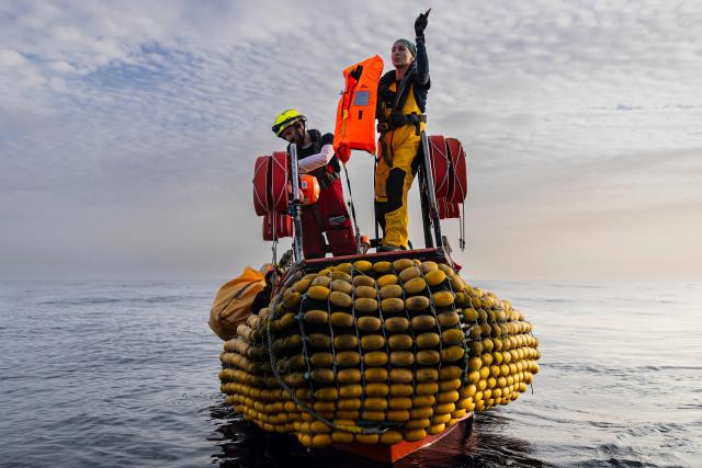 (FILES) Crew members of the “Ocean Viking” rescue ship, operated by the French NGO SOS Mediterranee, carry out a first-approach manoeuver during a team exercise to prepare for a rescue situation at sea with a "RHIB", an inflatable dinghy, on the way to the search-and-rescue zone in international waters off the coast of Libya, from Augusta, Sicily, southern Italy on December 25, 2025. (Photo by Sameer Al-DOUMY / AFP)