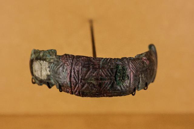This photograph shows items as part of the exhibition named Lavau 'A Celtic Prince on the edge of the Seine river' displayed at the Modern Art Museum of Troyes, on January 22, 2026. As it is one of the most important archaeological discoveries in France in 50 years, the exceptional treasure unearthed in the tomb of a Celtic prince in Lavau, in the northeast of the country, will be unveiled to the public for the first time on January 24. (Photo by STEPHANE DE SAKUTIN / AFP)