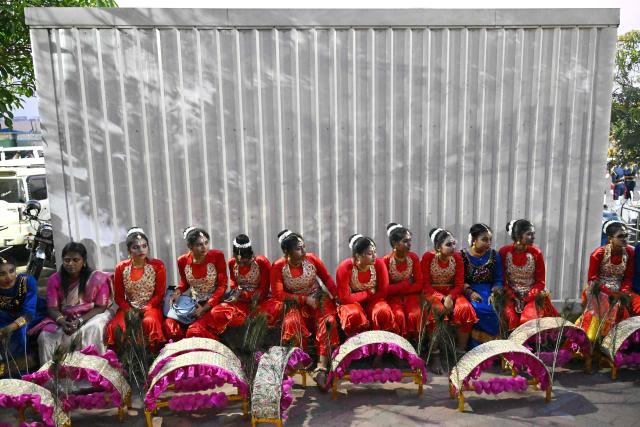 Folk artists from Tamil Nadu wait to take part in a rehearsal for the upcoming Republic Day celebrations in Chennai on January 23, 2026. (Photo by R.Satish BABU / AFP)