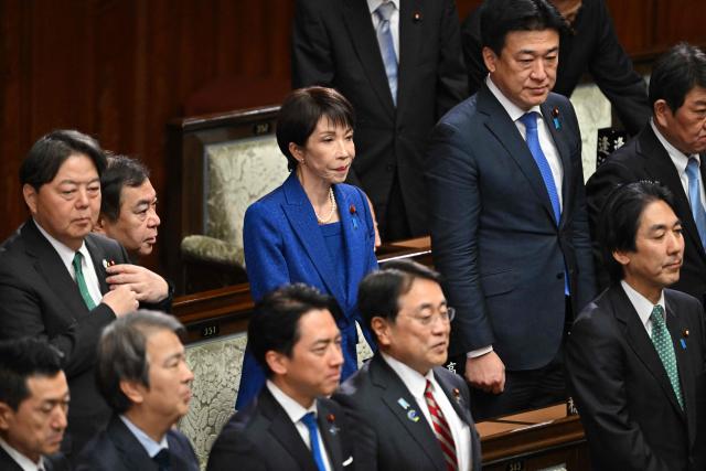 Japan's Prime Minister Sanae Takaichi (C) attends the House of Representatives plenary session at the Diet in Tokyo on January 23, 2026. Takaichi dissolved parliament ahead of a snap election on February 8, counting on her cabinet's high poll numbers to steer her otherwise unpopular ruling party to victory. (Photo by Kazuhiro NOGI / AFP)